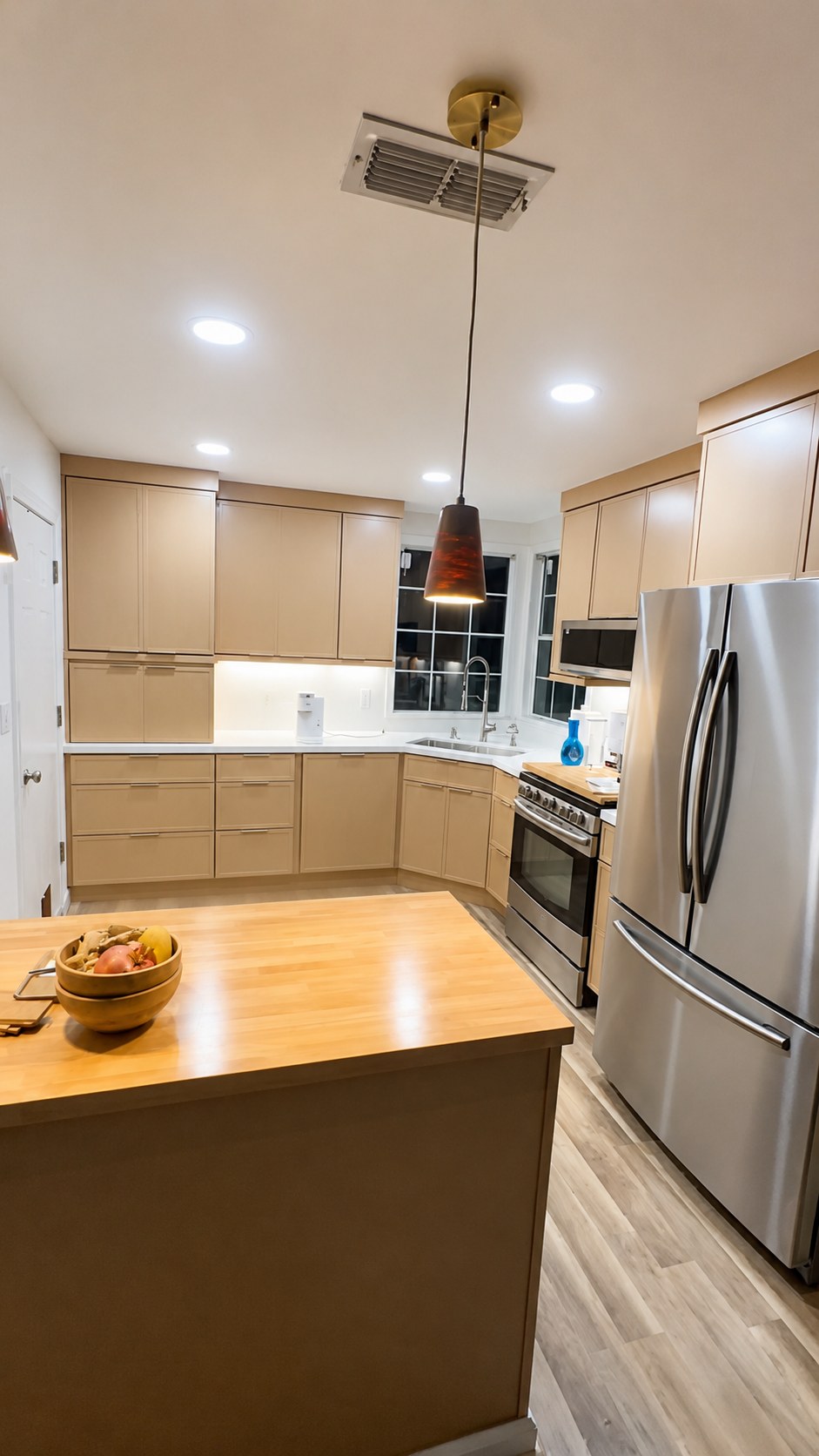 Kitchen remodel with cabinetry and butcher block island