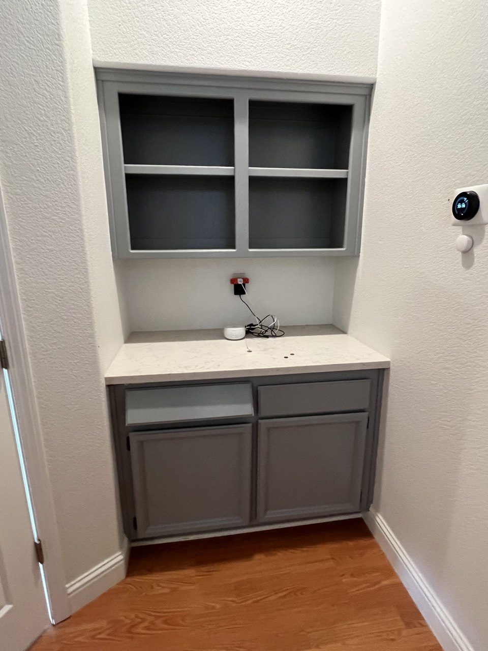 Built-in bar nook with glass-front cabinetry